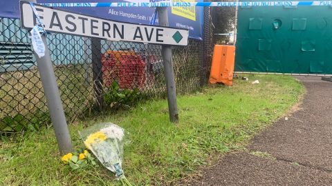 Flowers were laid at the entrance to the industrial park in Grays, Essex, where 39 bodies were found inside a truck container.