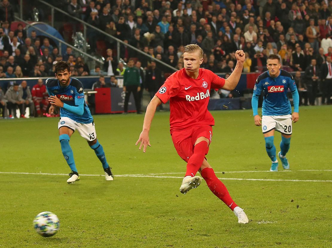 Salzburg's Norwegian forward H?land scores from the penalty spot against Napoli.