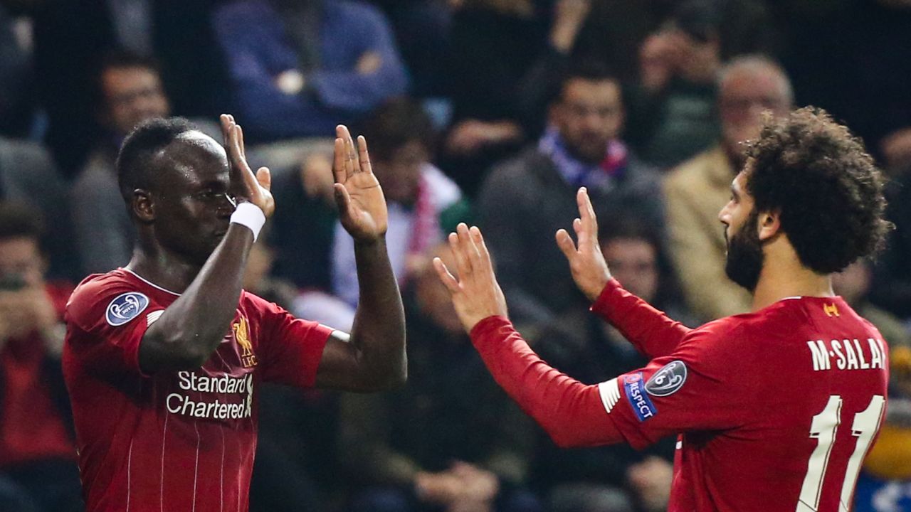 Liverpool's Sadio Mane (L) celebrates with teammate Mohamed Salah (R) after scoring.