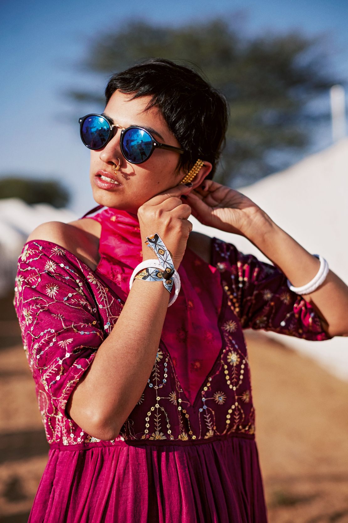 A woman fiddles with her earring in Alsisar, Rajasthan.