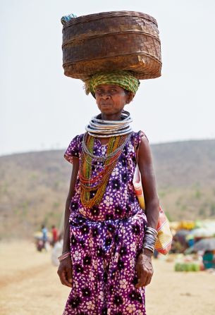 A woman with a basket on her head in Rayagada, Odisha.