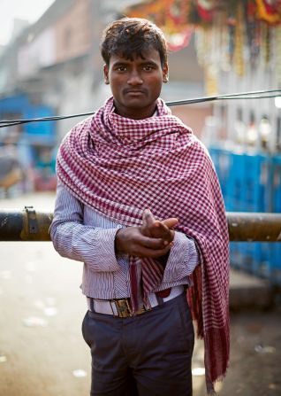 A man with a "gamcha" draped around his torso in Kolkata.