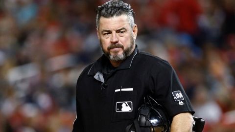 MLB umpire Rob Drake tweeted Tuesday he would buy an AR-15 rifle because of the impeachment inquiry, according to a copy of the tweet obtained by ESPN.