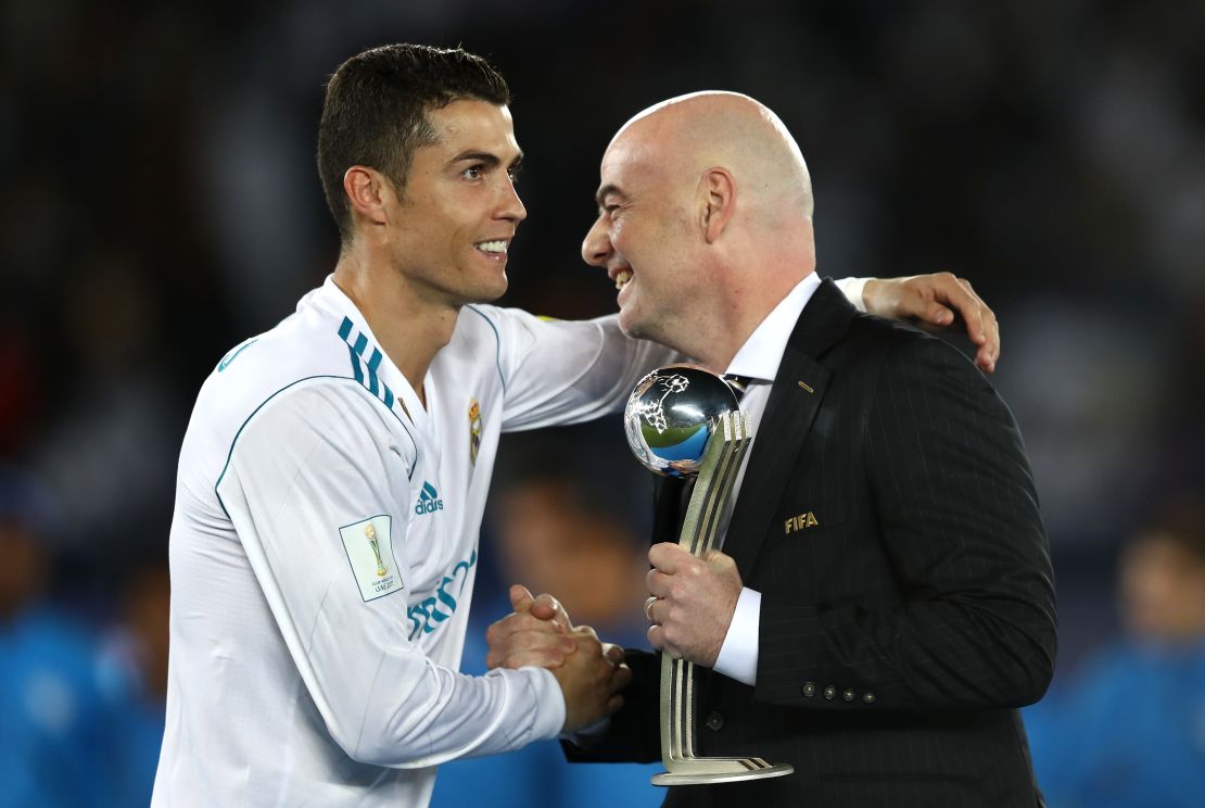 Cristiano Ronaldo collects the Silver Ball trophy from Gianni Infantino after winning the 2017 Club World Cup with Real Madrid.