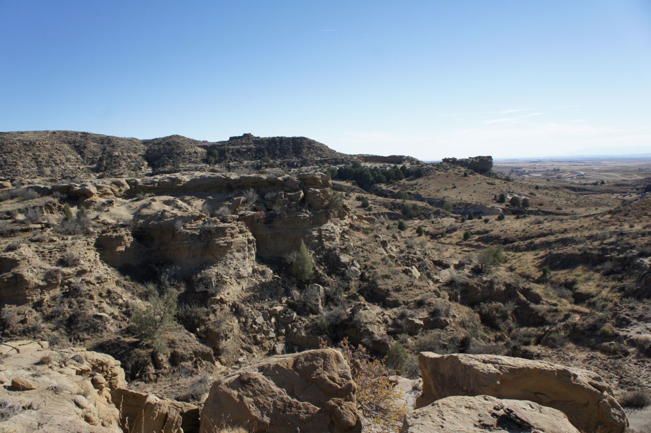 Corral Bluffs contains 300 vertical feet of rock, including hard yellow sandstone and mudstones, which represent ancient rivers and floodplains, respectively.