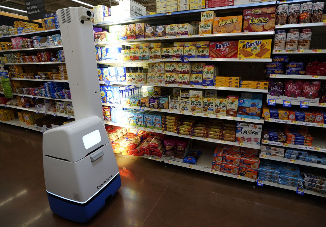 The "Auto-S," Walmart's shelf-scanning robot, moves around aisles and identifies which items are low or out of stock.

