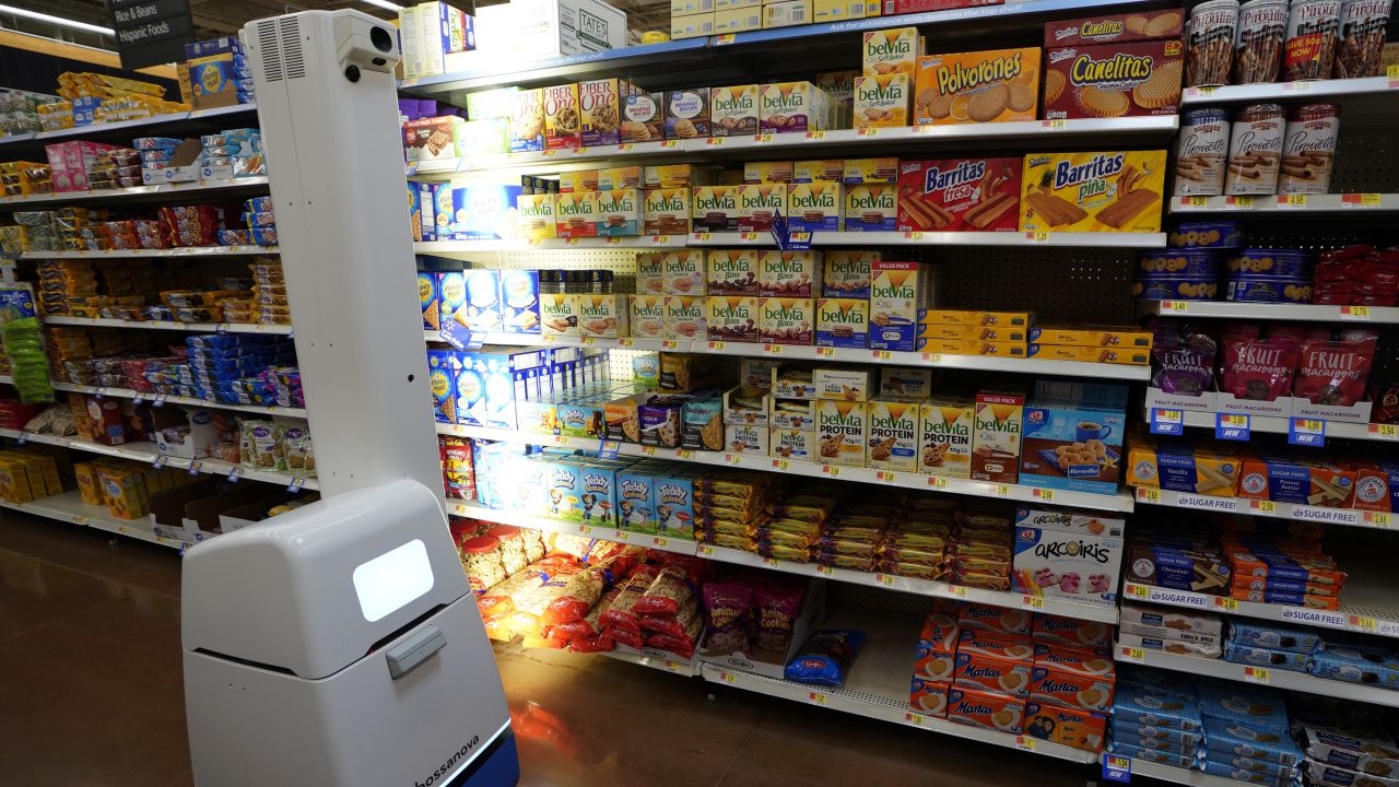 The "Auto-S," Walmart's shelf-scanning robot, moves around aisles and identifies which items are low or out of stock.
