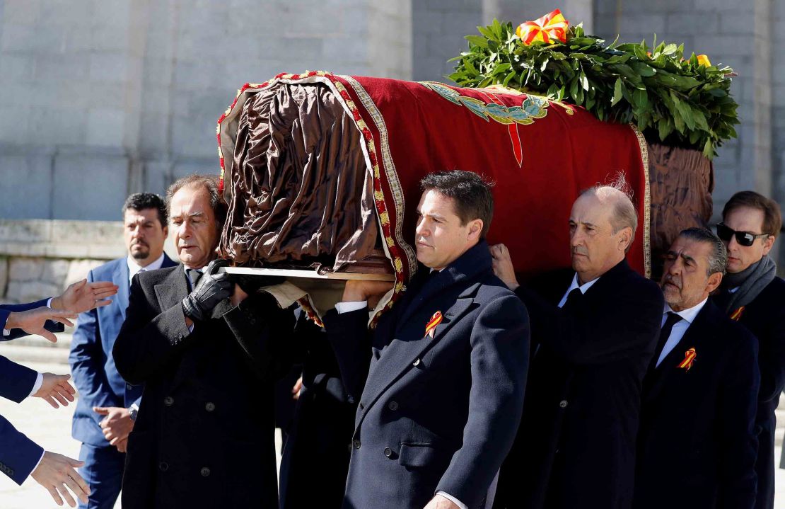 Family members Jose Cristobal (L) and Prince Louis Alphonse of Bourbon, Duke of Anjou (R), Francis Franco (3rdR) and Jaime Martinez-Bordiu (2ndR) carry the coffin of Spanish dictator Francisco Franco out of the basilica.