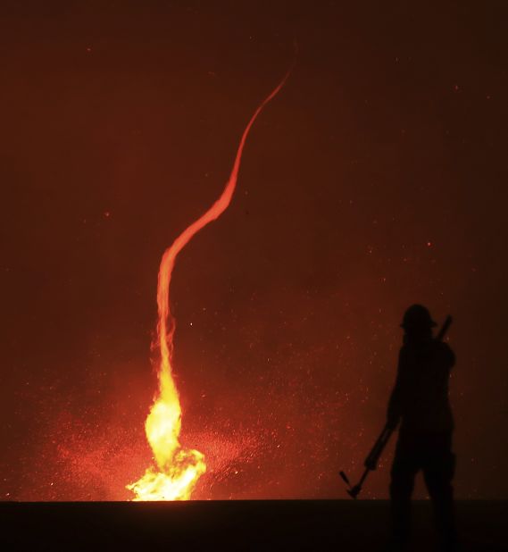 A fire whirl whips across dry brush as the Kincade Fire spreads through Sonoma County on October 24.