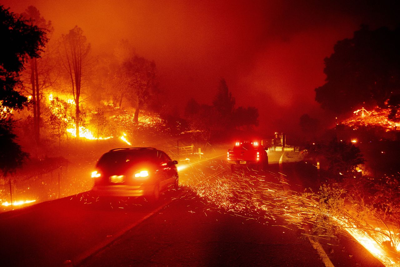 Embers fly across a roadway in Jimtown on October 24.