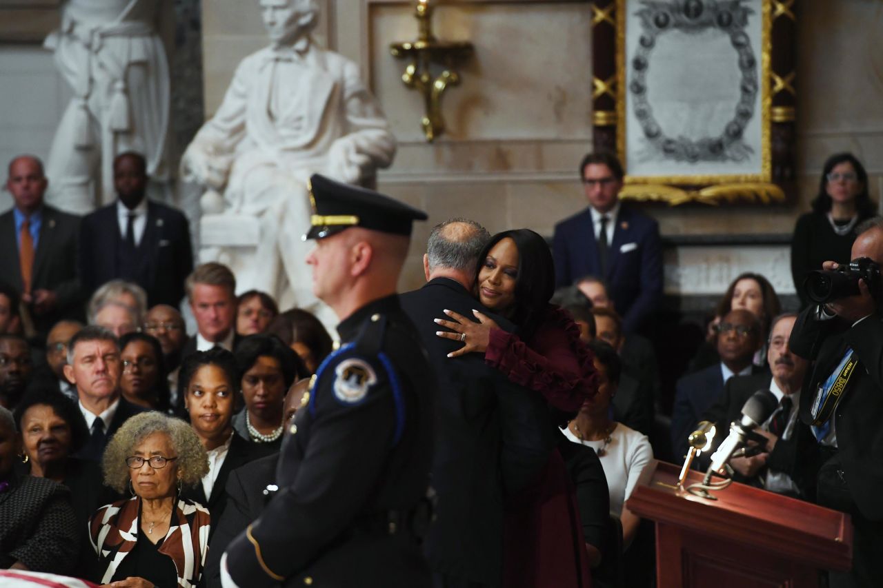 Cummings' wife is embraced by Senate Minority Leader Chuck Schumer.