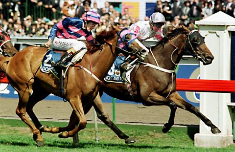 Jim Cassidy rides Might and Power (right) to a dramatic victory in 1997 by a nose ahead of Greg Hall on Doriemus in one of the tightest finishes in Melbourne Cup history. 