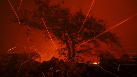 Embers blow in the wind as the Kincaide Fire burns in Geyserville, California.