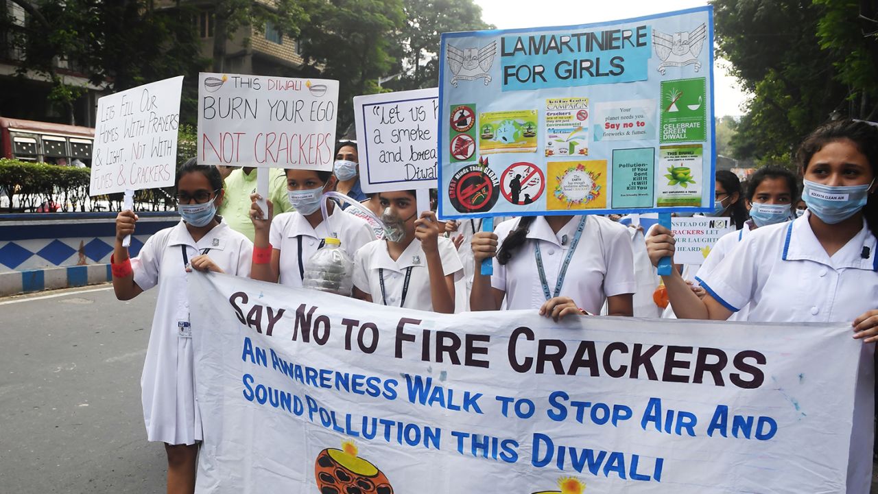 School students take part in a rally against fire cracker pollution in Kolkata on October 22, 2019.