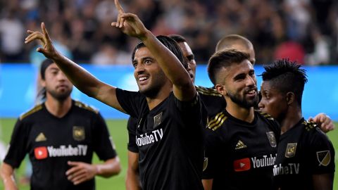 Carlos Vela (center) of LAFC celebrates his second goal against the LA Galaxy on Thursday in Los Angeles. The team's victory in the MLS Cup Playoffs was its first win against its inter-city rivals in six tries. 