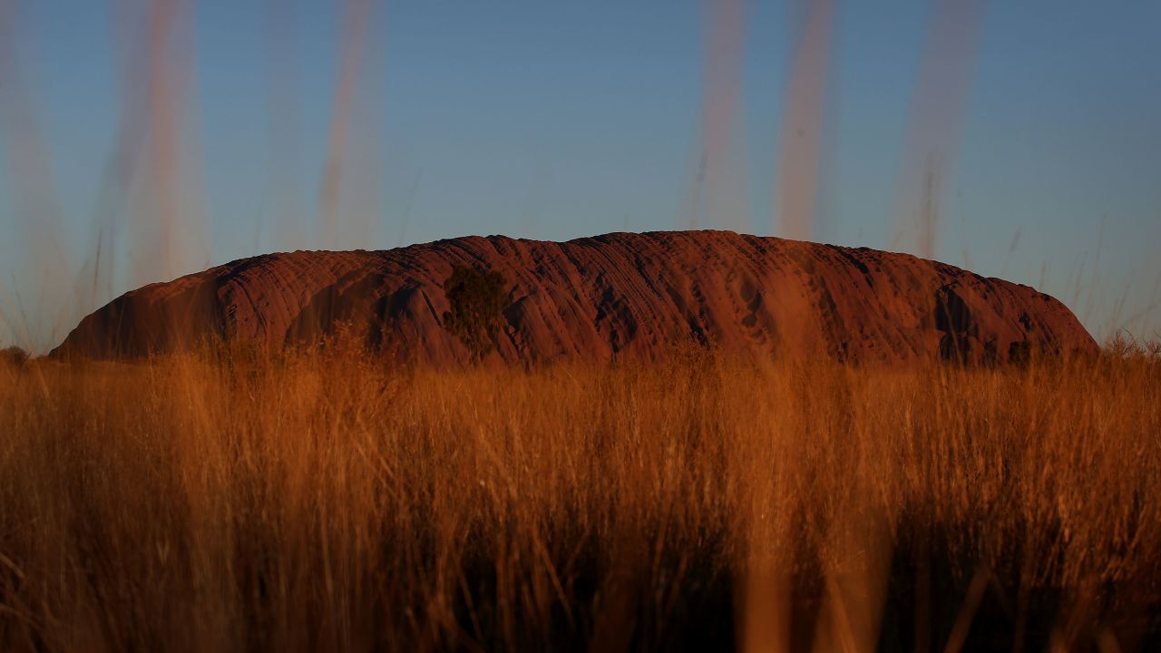 A sunset view of Uluru, which is viewed from the designated viewing area. 