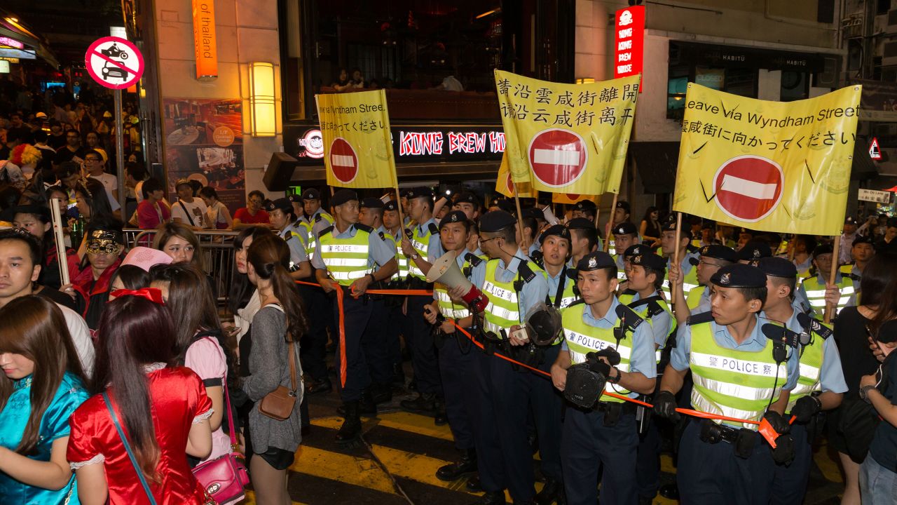 Hong Kong Police officers standing guard in Lan Kwai Fong in 2013.