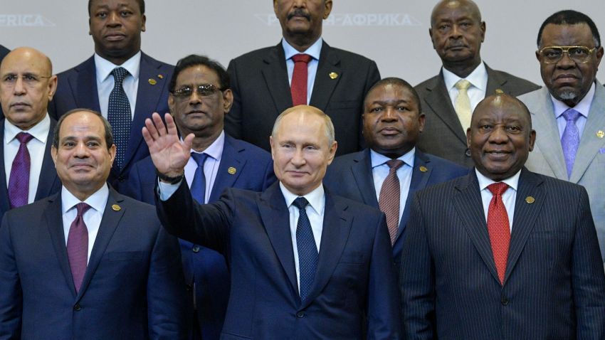 Russian President Vladimir Putin (C) gestures as Egypt's President Abdel Fattah al-Sisi (L) and South African President Cyril Ramaphosa (R) pose for a family photo with African countries leaders attending 2019 Russia-Africa Summit and Economic Forum in Sochi on October 24, 2019. (Photo by Alexei Druzhinin / SPUTNIK / AFP) (Photo by ALEXEI DRUZHININ/SPUTNIK/AFP via Getty Images)