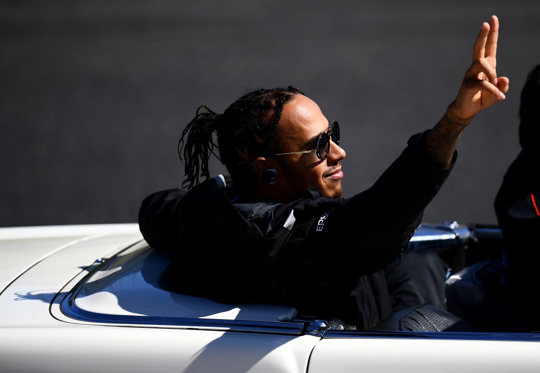 Hamilton waves to the crowd before the Japanese Grand Prix.