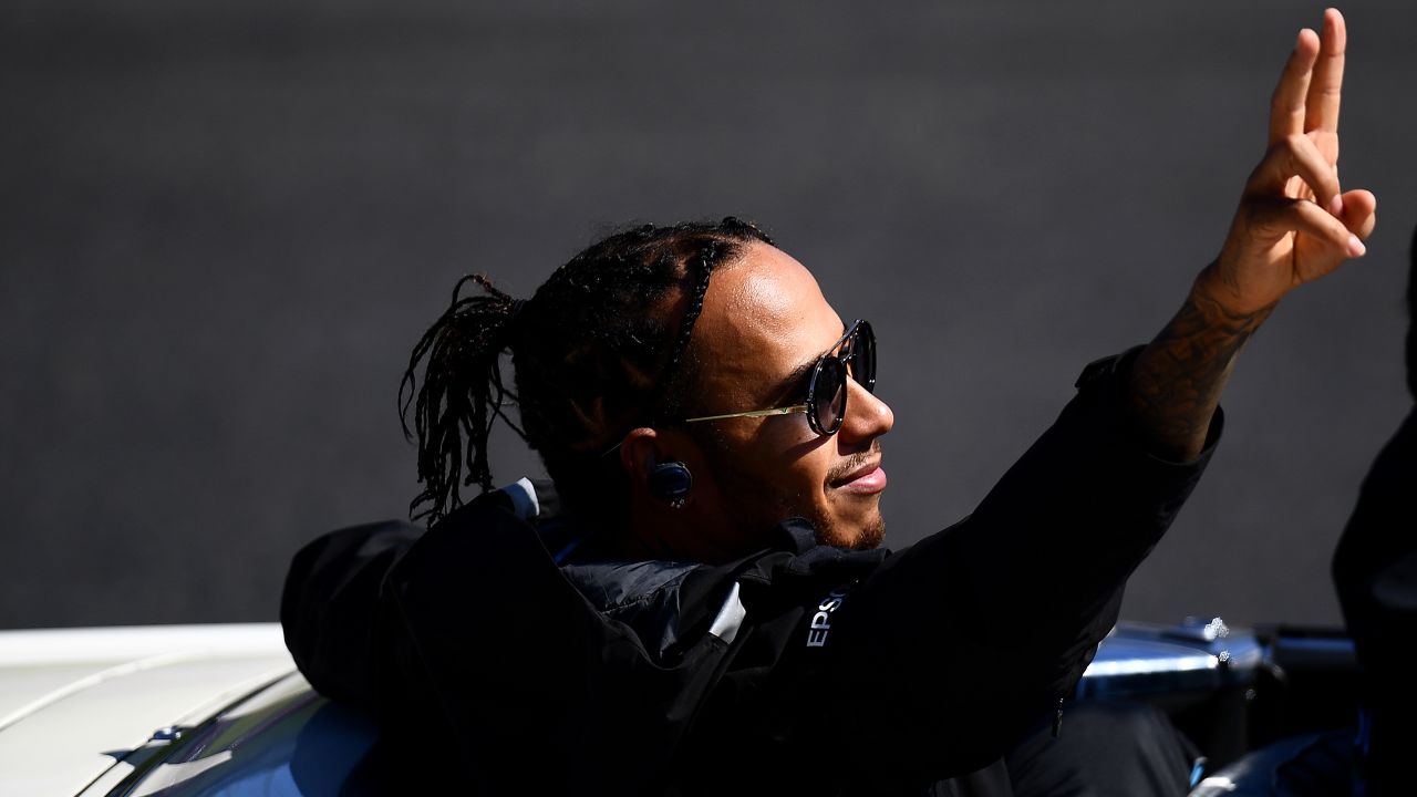Hamilton waves to the crowd before the Japanese Grand Prix.