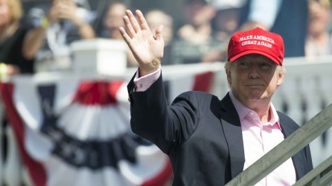 US President Donald Trump waves to wellwishers as he arrives at the 72nd US Women's Open Golf Championship at Trump National Golf Course in Bedminster, New Jersey, July 16, 2017. / AFP PHOTO / SAUL LOEB (Photo credit should read SAUL LOEB/AFP/Getty Images)
