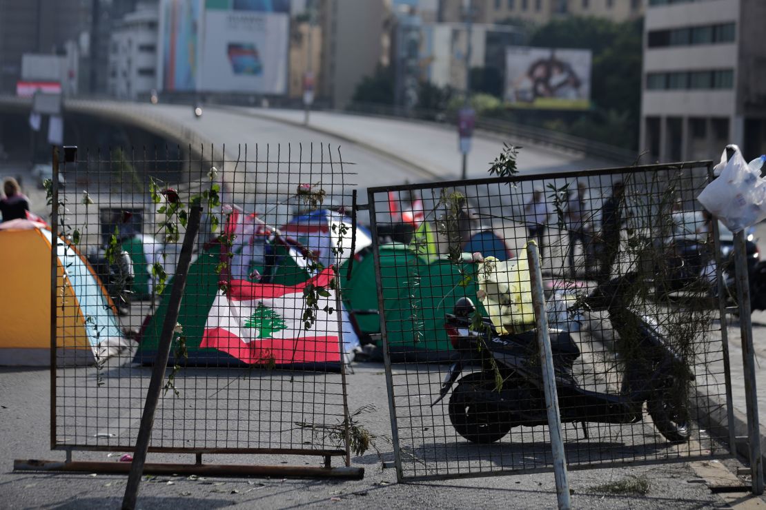 Anti-government protesters block the main highway linking east and west Beirut with tents, stones and bricks on Friday. 