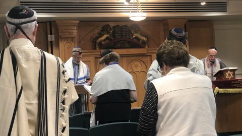 Joe Charny, right, leads a morning service ahead of the anniversary of the massacre at the Tree of Life synagogue.