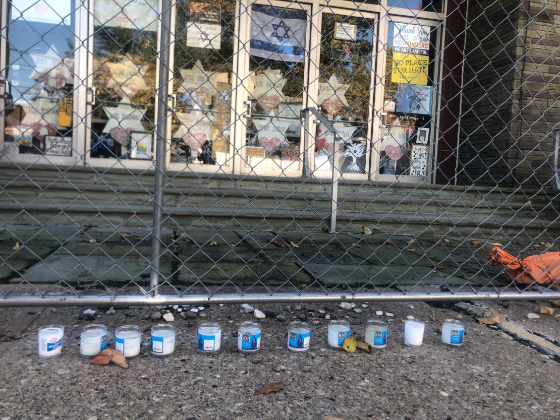 Eleven memorial candles for the victims remain outside the Tree of Life synagogue.