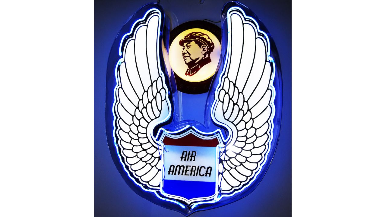 <strong>Air America: vs Mao:</strong> An artistic juxtaposition of imagined neon logos adorns the Patpong Museum, emphasizing the fight between communist China and the CIA's Air America during the 1960s to 1975.<br />
