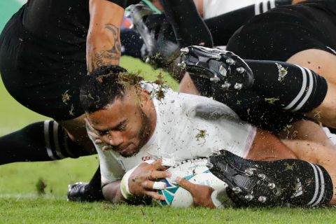 England's Manu Tuilagi scores after a powerful start from his side in the semifinal against three-time champion New Zealand.