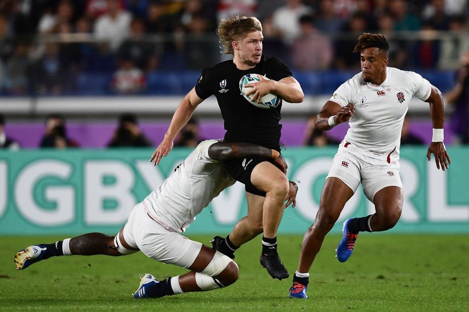 New Zealand's centre Jack Goodhue is tackled by Courtney Lawes as a dominant England trounces New Zealand 19-7 to reach its first World Cup final since 2007.