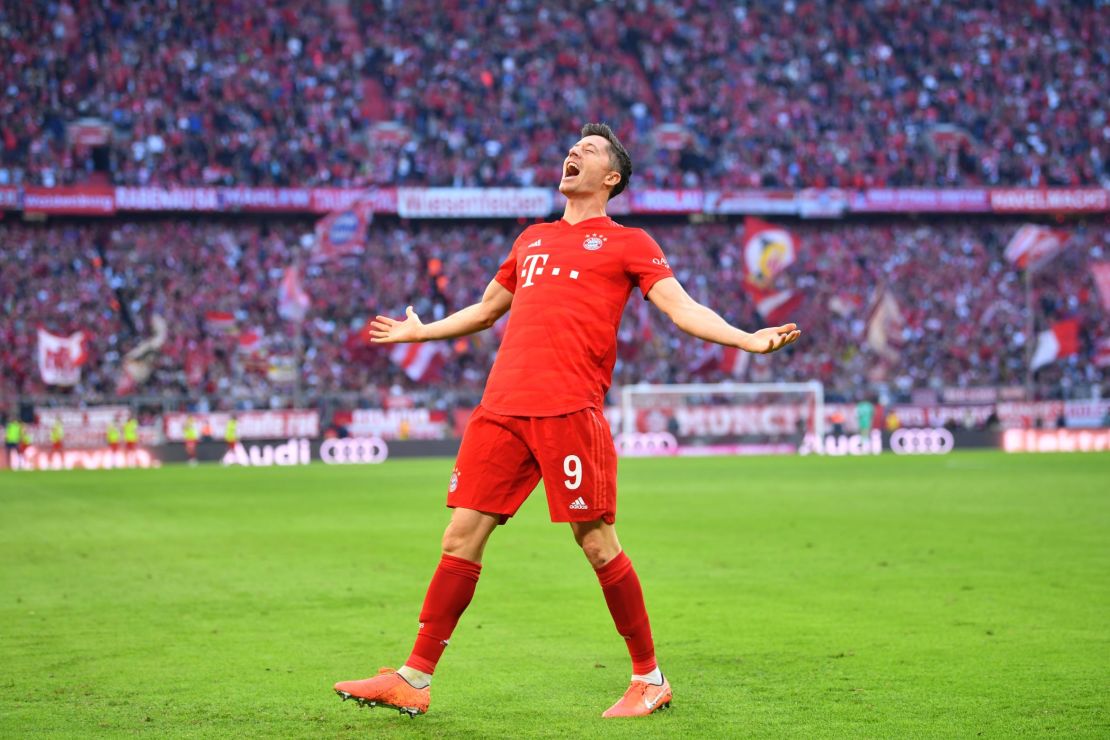 Robert Lewandowski celebrates his goal for Bayern Munich in the 2-1 win over Union Berlin to set a new Bundesliga record of scoring in nine straight league games.