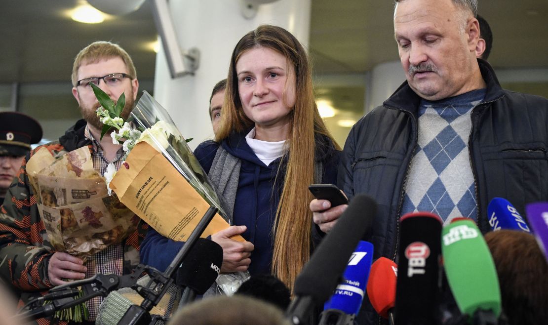 Maria Butina speaks to reporters upon her arrival at Moscow's Sheremetyevo airport.