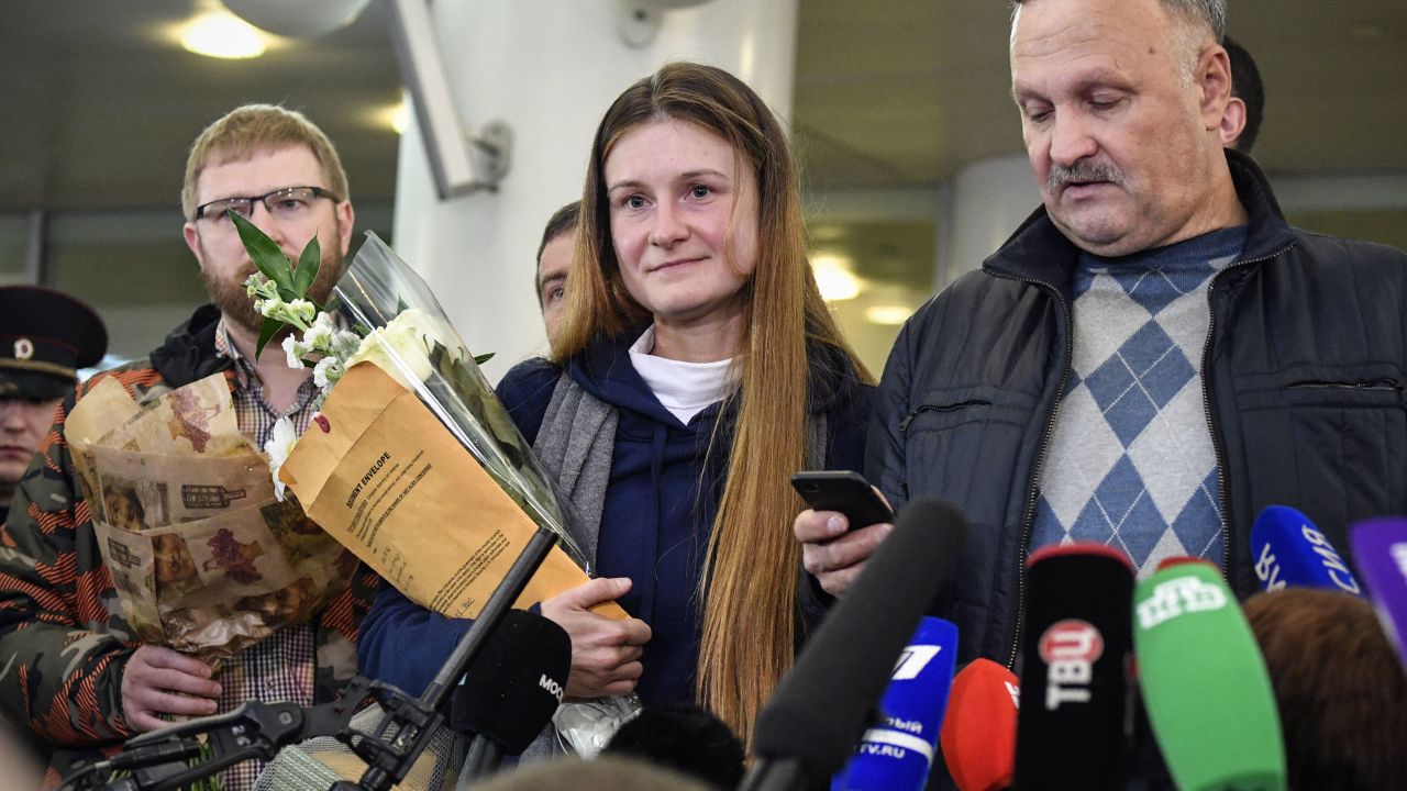 Maria Butina speaks to reporters upon her arrival at Moscow's Sheremetyevo airport.