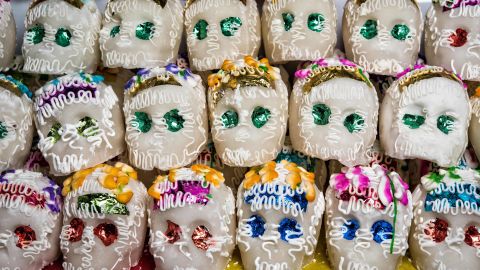 Skulls made and decorated with sugar decorate altars and are given as gifts for Día de los Muertos.