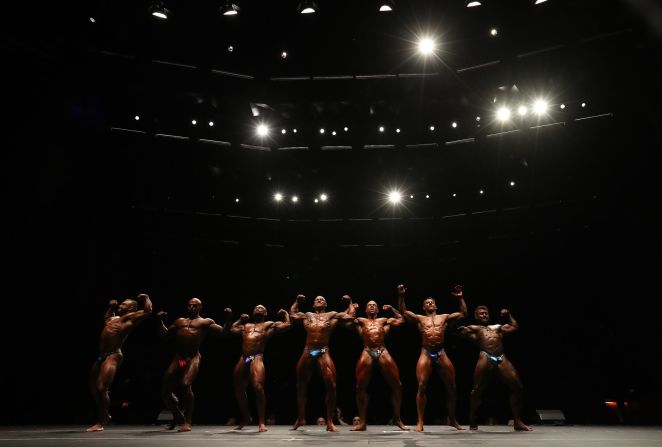 Bodybuilders pose at the Australian National Championships on Sunday, October 20.