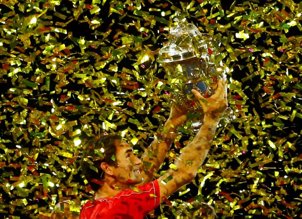 Roger Federer celebrates with his trophy after winning the Swiss Indoors on Sunday, October 27.