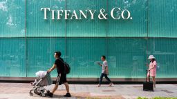 Pedestrians walk past an American luxury jewellery and speciality retailer Tiffany & Co. store in Shanghai.