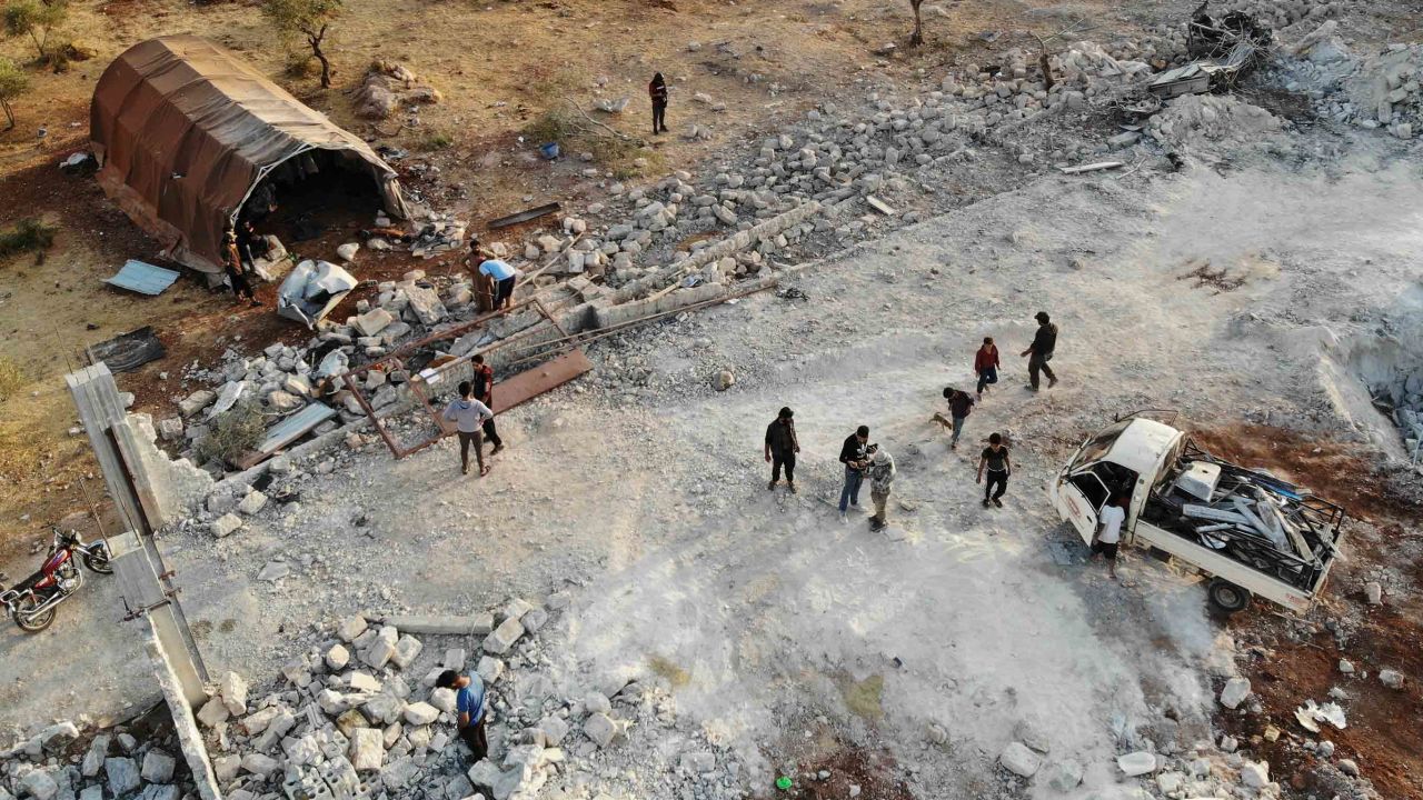 TOPSHOT - An aerial view taken on October 27, 2019 shows the site that was hit by helicopter gunfire which reportedly killed nine people near the northwestern Syrian village of Barisha in the Idlib province along the border with Turkey, where "groups linked to the Islamic State (IS) group" were present, according to a Britain-based war monitor with sources inside Syria. - The helicopters targeted a home and a car on the outskirts of Barisha, the Syrian Observatory for Human Rights said, after US media said IS leader Abu Bakr al-Baghdadi was believed to be dead following a US military raid in the same province. Observatory chief Rami Abdel Rahman said the helicopters likely belonged to the US-led military coalition that has been fighting the extremist group in Syria. (Photo by Omar HAJ KADOUR / AFP) (Photo by OMAR HAJ KADOUR/AFP via Getty Images)