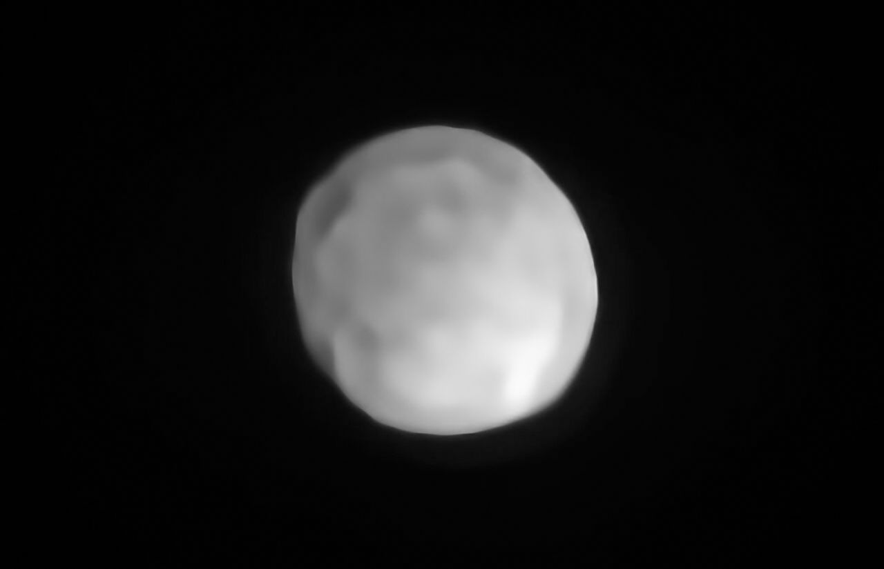 A new SPHERE/VLT image of Hygiea, which could be the Solar System's smallest dwarf planet yet. As an object in the main asteroid belt, Hygiea satisfies right away three of the four requirements to be classified as a dwarf planet: it orbits around the Sun, it is not a moon and, unlike a planet, it has not cleared the neighbourhood around its orbit. The final requirement is that it have enough mass that its own gravity pulls it into a roughly spherical shape. This is what VLT observations have now revealed about Hygiea.