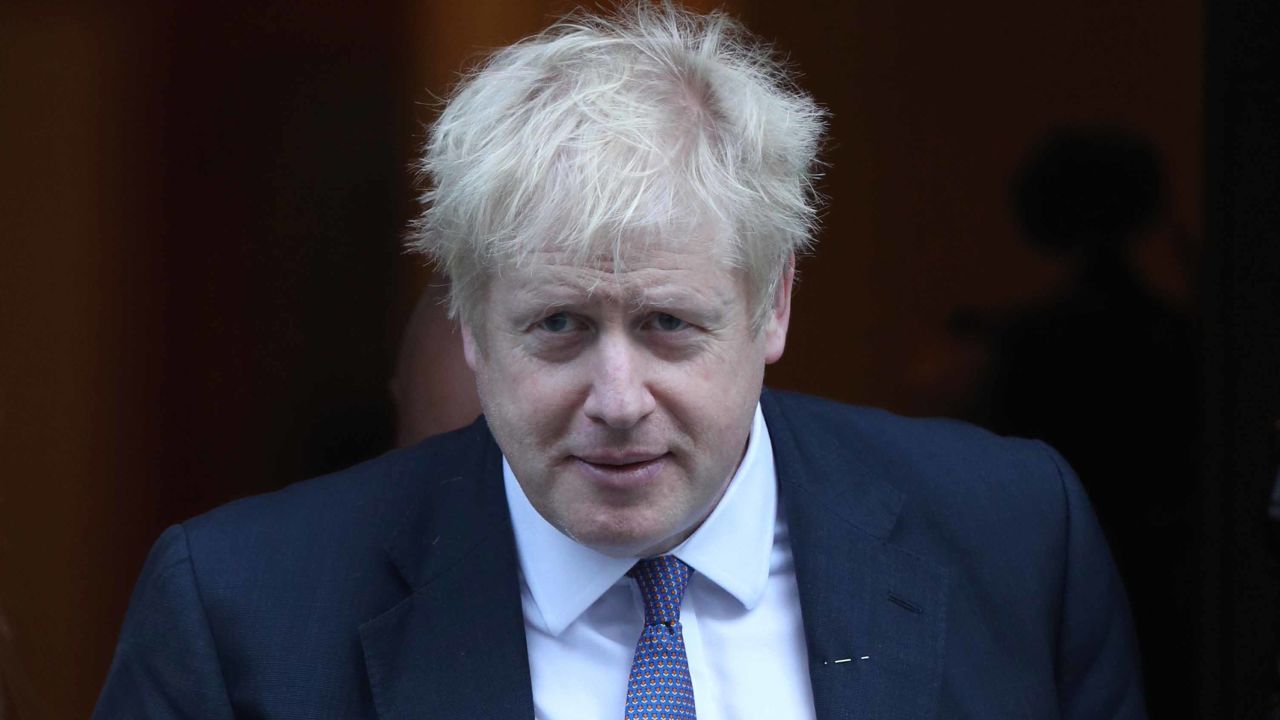 Prime Minister Boris Johnson meets with fundraisers for the Royal British Legion and purchases a poppy in front of the Downing Street door. (Photo by Yui Mok/PA Images via Getty Images) 28 October, 2019