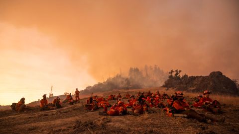 A crew of inmate firefighters takes a break during firefighting operations to battle the Kincade Fire in Healdsburg, California on October 26, 2019. 