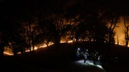 SANTA ROSA, CA - OCTOBER 28: Firefighters walk near a fire line along Mayacama Club Drive as the Kincade Fire burns on the outskirts of Santa Rosa, Calif., on Oct. 28, 2019. (Photo by Dai Sugano/MediaNews Group/The Mercury News via Getty Images)