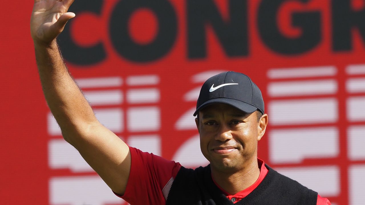 Woods waves after winning his 82nd PGA Tour title Sunday. 