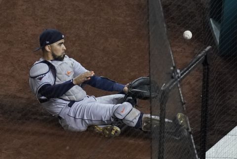 Houston catcher Robinson Chirinos slides for a foul ball during Game 4, but he was unable to make the catch.