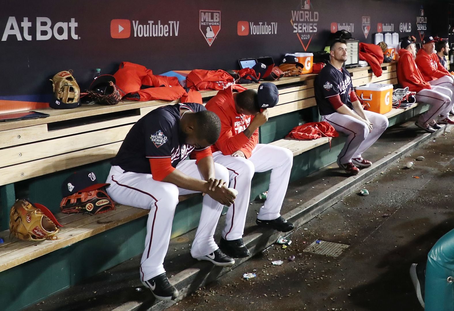Washington players react in the dugout during the ninth inning of Game 5. The Nationals lost 7-1 to fall behind three games to two. They lost all three of their home games, scoring only one run in each.