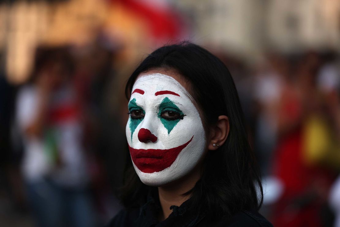 Cynthia Aboujaoude painted her face to resemble the Joker during a protest in downtown Beirut on October 19.