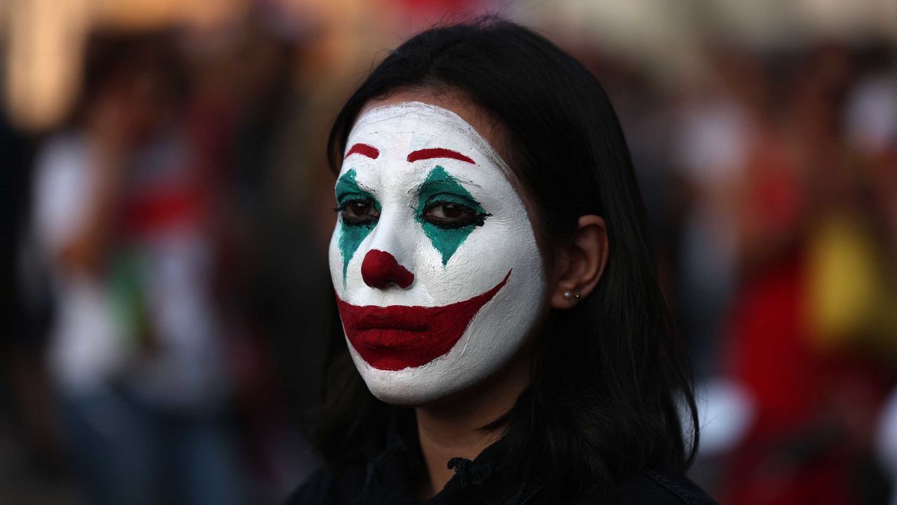 Cynthia Aboujaoude painted her face to resemble the Joker during a protest in downtown Beirut on October 19.