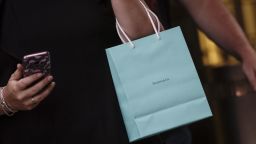 A shopper carries a Tiffany & Co. retail bag on Fifth Avenue in New York, U.S., on Thursday, May 30, 2019. Tiffany & Co. is scheduled to release earnings figures on June 4. Photographer: Victor J. Blue/Bloomberg via Getty Images