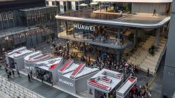 This aerial photo taken on September 28, 2019 shows people visiting a newly-opened Huawei flagship store in Shenzhen in China's southern Guangdong province. (Photo by STR / AFP) / China OUT        (Photo credit should read STR/AFP/Getty Images)